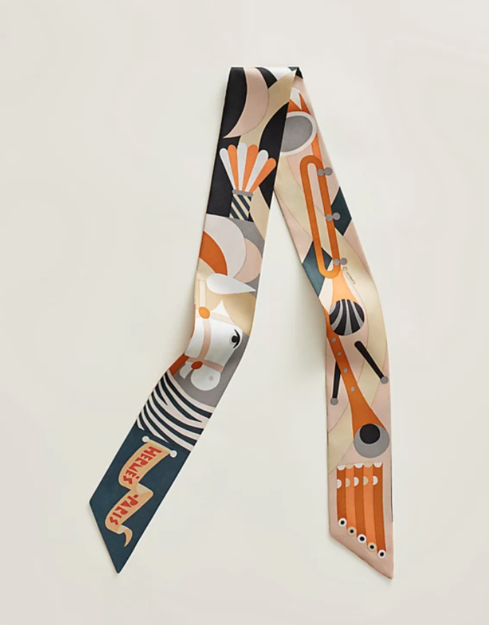 Hermes Parade en Fanfare Twilly in Noir / Caramel / Gris Hermes Parade en Fanfare Twilly in Noir / Caramel / Gris